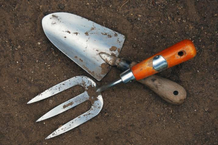 Garden tools dirty with soil and debris