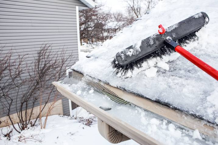 Removing ice dam during winter home maintenance