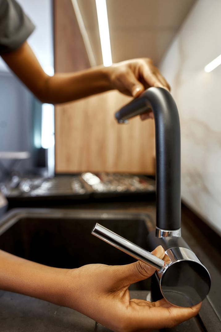 a handyperson installing a kitchen tap