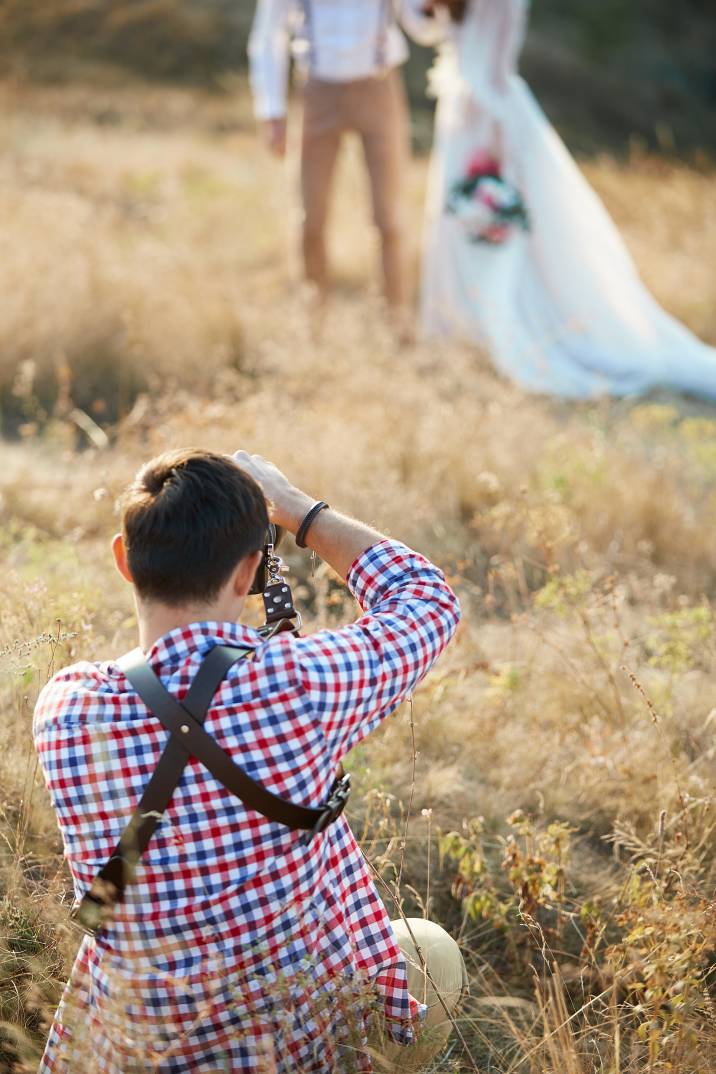 a wedding photographer outdoors